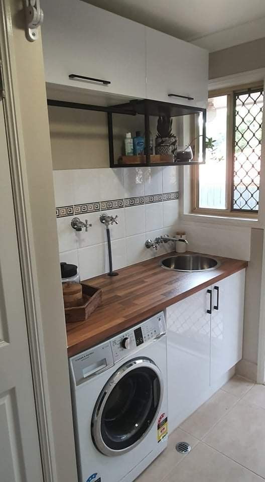 a washer and dryer in a small kitchen