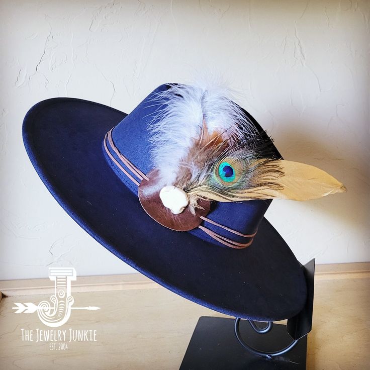 If you’re looking for the perfect accessory to complement your favorite boho style, look no further. This Boho-Style Western Felt Hat w/ Natural Feather & Turquoise Hat Accent by The Jewelry Junkie is absolutely everything that you need. Not only is it easy to incorporate into any and all outfits, but the genuine leather and natural feathers of the band immediately elevate whatever it is you’re wearing. One Size Hat with adjustable inner hat liner (see last photos) The same primary feathers will Bohemian Adjustable Felt Hat For Kentucky Derby, Adjustable Bohemian Felt Hat For Kentucky Derby, Blue Hat For Kentucky Derby Festival, Blue Hat For Kentucky Derby, Bohemian Fedora For Kentucky Derby, Bohemian Felt Hat For Kentucky Derby With Brim, Bohemian Brimmed Felt Hat For Kentucky Derby, Bohemian Felt Hat With Flat Brim For Kentucky Derby, Blue Brimmed Fedora For Western-themed Events