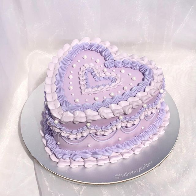 a heart shaped cake sitting on top of a table