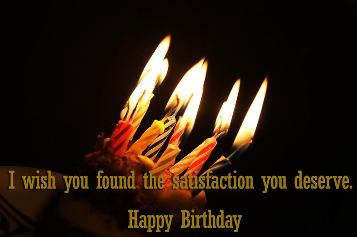 a birthday cake with lit candles in the middle that says i wish you found the satisfaction you deserves