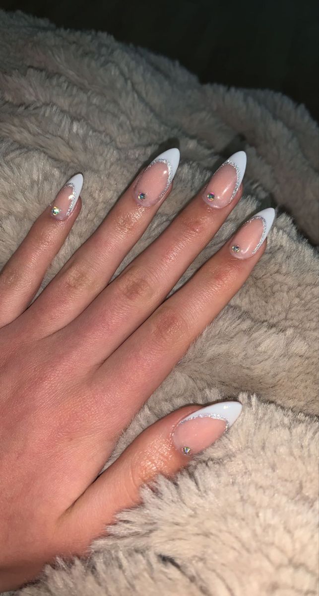 Gems With French Tip, French Tip Acrylic Nails Almond With Gems, Nails For Graduation Almond, Sparkly French Tip Almond Nails, Sparkly Rhinestone Nails, Nail Ideas French Tip With Gems, Rhinestone Nails Almond Shape, Almond French With Glitter, Almond French Tips With Glitter