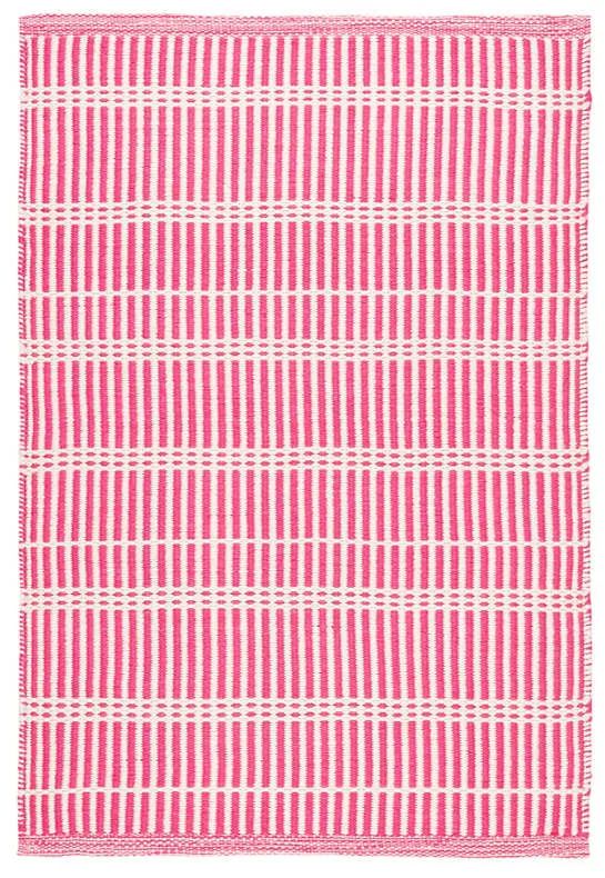 a pink and white checkered rug on a white background