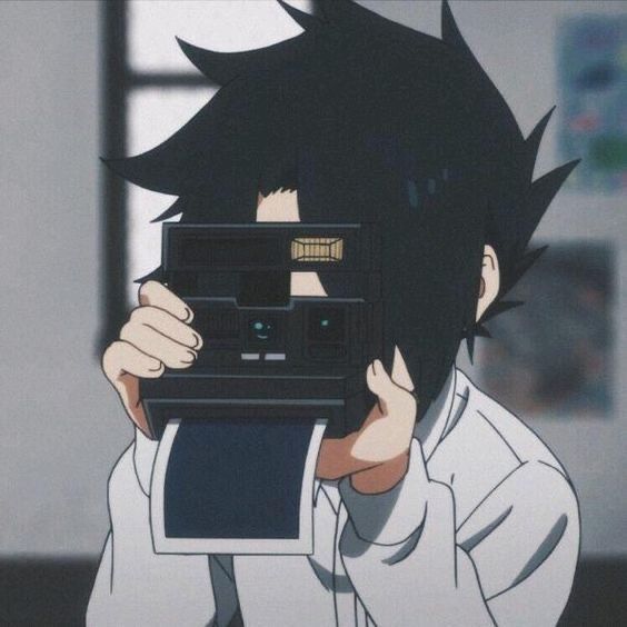 an anime character holding up a camera in front of his face