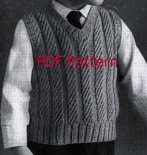 an old black and white photo of a young boy wearing a knitted sweater vest