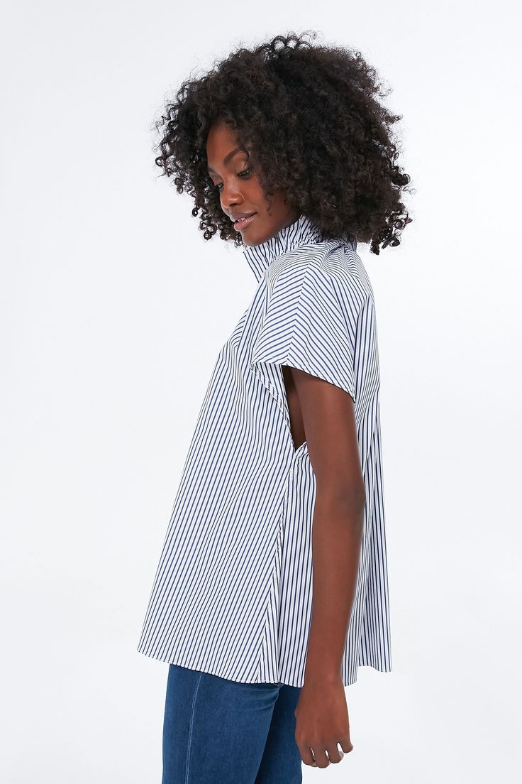 Effortlessly chic, the Rae Blouse takes everything we love about a classic button down and elevates it with fun, feminine details. Featuring a high neck ruffle collar, short cap sleeves, and a button front placket, this blue stripe shirt pairs well with denim and flats for daytime and gold jewelry for dining out with friends. Ruffle collar Short cap sleeves Front placket Blue stripe Material: 96% Polyester, 4% Spandex Care: Hand wash cold, hang to dry Summer Short Sleeve Blouse With Striped Collar, Short Sleeve Top With Striped Collar For Daywear, Blue Blouse With Striped Collar And Short Sleeves, Summer Blouse With Striped Collar, Chic Blouse With Striped Collar For Day Out, Short Sleeve Blouse With Striped Collar For Work, Daywear Blouse With Striped Collar And Short Sleeves, Casual High Neck Blouse For Workwear, Casual High-neck Blouse For Workwear