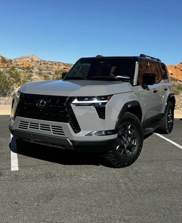 a silver suv parked in a parking lot