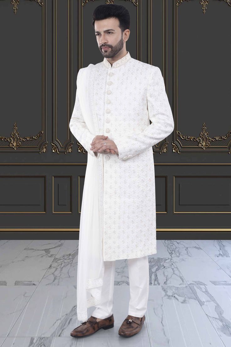 Elevate your wedding look with our Mens Sherwani- M42-S130. Made with quality fabric and intricate designs, this groom sherwani comes with a dupatta for added elegance. Expertly crafted for a perfect fit, this sherwani will make you stand out on your special day. Elegant Sherwani With Dupatta For Reception, Bollywood Style Suits With Traditional Drape For Weddings, White Sherwani For Men Wedding, Traditional Suits With Dupatta For Reception, Bollywood Style Wedding Suit With Traditional Drape, Traditional Bollywood Wedding Suits With Drape, Fitted Sherwani With Chikankari Embroidery For Groom, Fitted Chikankari Embroidery Sherwani For Groom, Groom's Eid Sherwani With Chikankari Embroidery