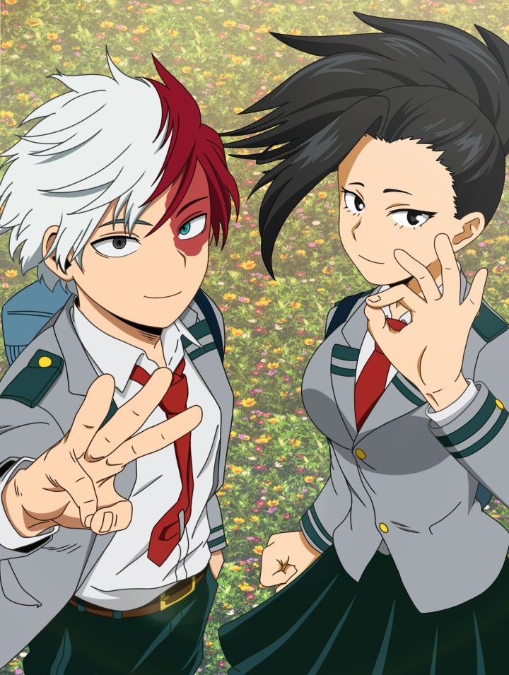 two anime characters standing next to each other in front of grass and flowers with their hands together