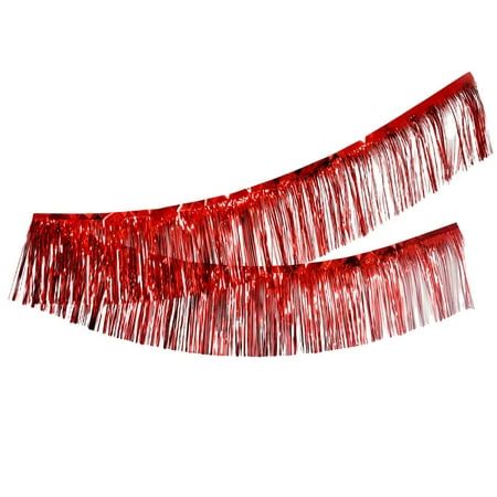 two red tinsel fringes are on the white background, one is long and shiny