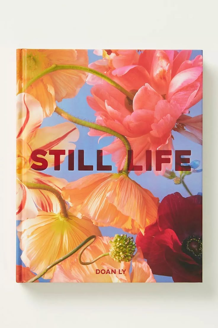 a book with the title still life written in red and orange flowers on it's cover