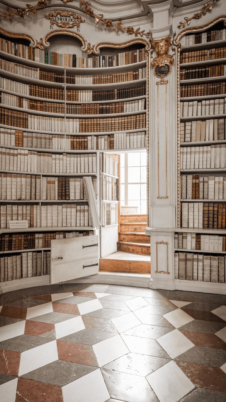 an empty room with many books on the shelves