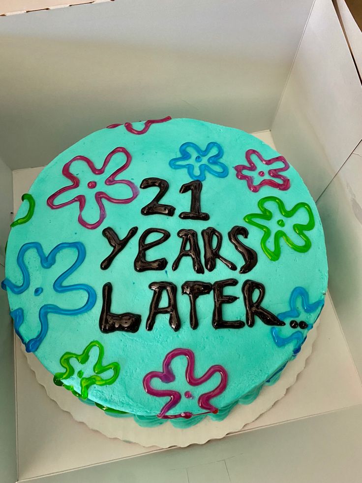 a birthday cake with the words 21 years later written on it in blue frosting