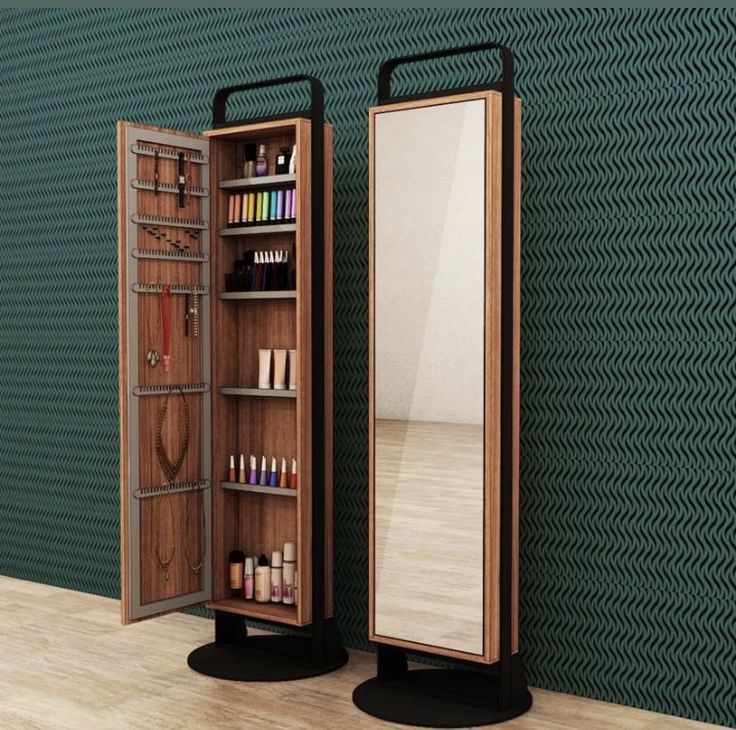 an open wooden medicine cabinet next to a mirror on top of a hard wood floor