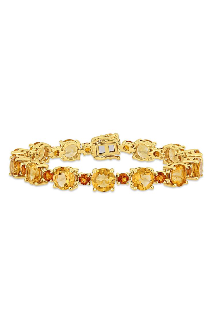 Glistening citrines and madeira citrines add a shimmering effect to this gorgeous gold plated sterling silver jewerly piece for a sophisticated statement. 7.25" length; 0.47" width Tongue-and-groove closure with safety clasp Gem weight: 30.1ct. 10k-yellow gold plated sterling silver/citrine/madeira citrine Imported Luxury Hallmarked Citrine Jewelry, Luxury Citrine Gemstone Jewelry, Faceted Gold Gemstones For Fine Jewelry, Formal Gold Bracelets With Gemstone Accents, Hallmarked Citrine Jewelry In Orange, Fine Jewelry Citrine Multi-stone, Gold Multi-stone Citrine Gemstones, Multi-stone Citrine Fine Jewelry, Elegant Faceted Citrine Bracelets