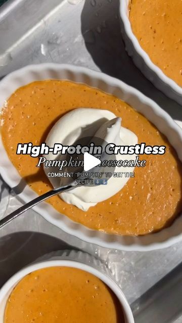 two white bowls filled with carrot pudding and whipped cream