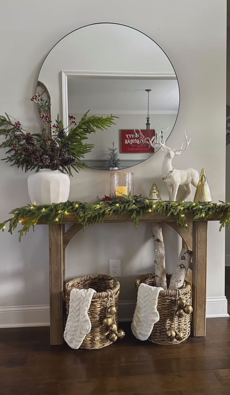 a christmas mantle with stockings and decorations on it