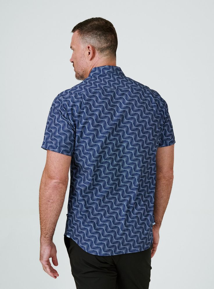 We created the perfect short sleeve button up, with the right mixture of comfort and style, just for you. Our performance shirts have 4-way stretch, are moisture wicking, wrinkle resistant and above all a great new addition to your wardrobe. The performance shirt will be your go-to for any occasion - day to night. This is a shirt that will have you satisfied at any given time. Details Model is 6'1" and wears a size medium. Care: Machine wash cold on delicate cycle with similar colors. Do not use Casual Cotton Shirt With 4-way Stretch, Fitted Short Sleeve Versatile Shirt, Versatile Fitted Short Sleeve Shirt, Casual Short Sleeve Shirt With 4-way Stretch, Blue Stretch Short Sleeve Shirt, Casual Short Sleeve Stretch Shirt, Blue Fitted Short Sleeve Camp Shirt, Fitted Blue Short Sleeve Camp Shirt, Navy Short Sleeve T-shirt For Game Day