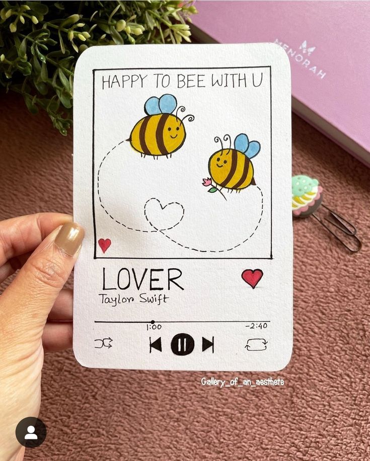 someone holding up a card with two bees on it and the words happy to bee with u