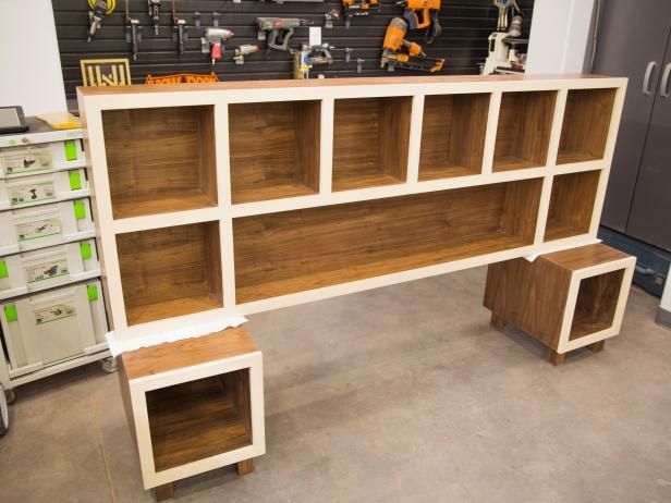 the shelves are made out of wood and have different types of drawers on each shelf