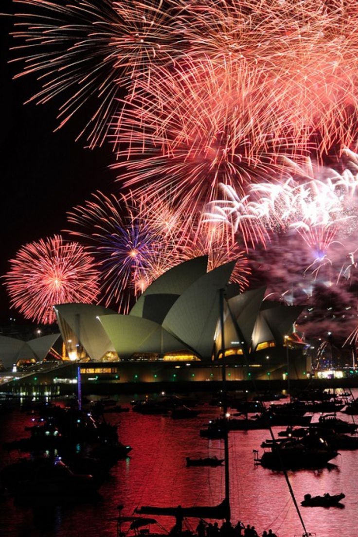 fireworks are lit up over the sydney opera house and harbour during new year's eve celebrations