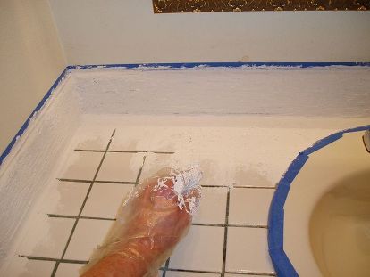 a person's foot in the middle of a bathroom floor