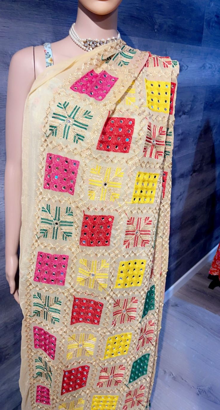 "Team Up This Dupatta With Both Ethnic And Western Outfits For Timeless Signature Styles. The Word \"\"PHULKARI\"\" Has Its Origins In Punjab Which Means Flower Work. This Is An Emboidery Technique Which Can Be Found In The Holy City Of Amritsar. This Floral Multi-Coloured Pattern Has Been Adorned By Many Generations In Punjab. This Is Specially Used Ss \"\"CHADDAR\"\" Which Is Carried By The Bride's Brothers When She Enters The Wedding Ceremony. Colors: Some of these are available in different Beige Dupatta For Navratri, Beige Cutdana Dupatta For Navratri, Multicolor Semi-stitched Embroidered Fabric For Puja, Multicolor Dupatta With Cutdana For Puja, Navratri Embroidered Fabric With Motifs, Bohemian Festival Dupatta, Multicolor Embroidered Dupatta With Motifs, Bohemian Chikankari Embroidered Fabric For Festival, Bohemian Multicolor Embroidered Fabric