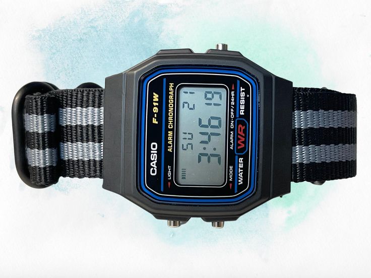 This retro Casio in stock form is already cool, functional, affordable, and accurate-- but with some magic from RLSWW, it's made even cooler-- with a ballistic nylon strap to match your personality. In addition-- you may select the option to modify the screen color to further reflect your tastes and bring some color to your wrist. Note, this is a permanent modification to the screen, not the LED backlight. It will be colored in all light conditions :) Please note: This is a permanent modificatio Black Retro Analog Watch, Retro Black Analog Watch, Retro Black Analog Watches, Retro Black Analog Watch Accessories, Retro Black Watch With Stopwatch, Adjustable Black Sports Watch Bands, Casual Black Digital Watch With Adjustable Strap, Casual Black Sports Watch Accessories, Casual Black Watch Accessories With Stopwatch