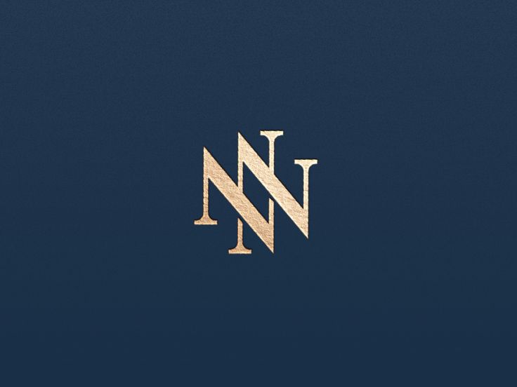 the letter n is made up of gold and silver lines on a dark blue background