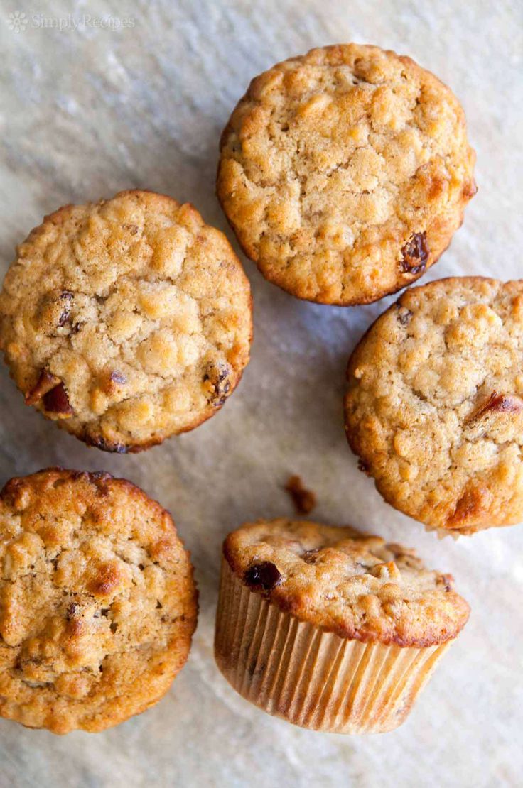 four muffins sitting next to each other on top of a white countertop