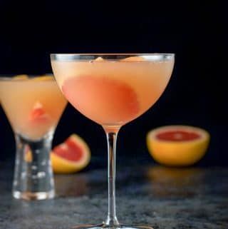 two glasses filled with watermelon and orange juice