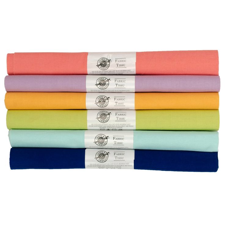 four different colored sheets stacked on top of each other in rows, with one folded over the