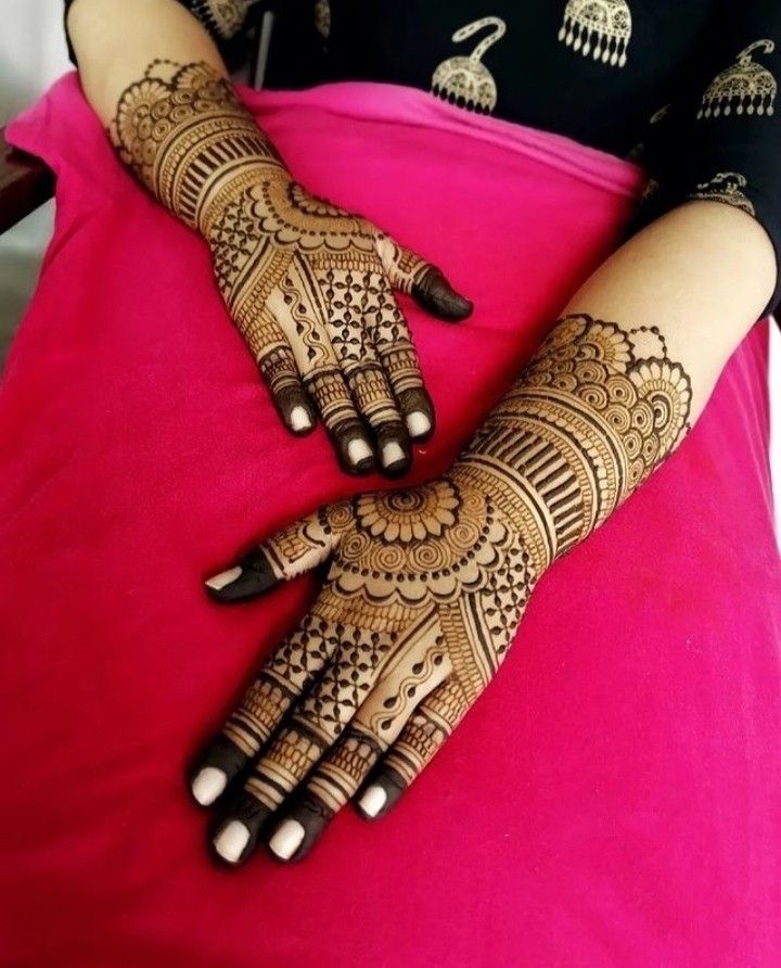 a woman with henna on her hands