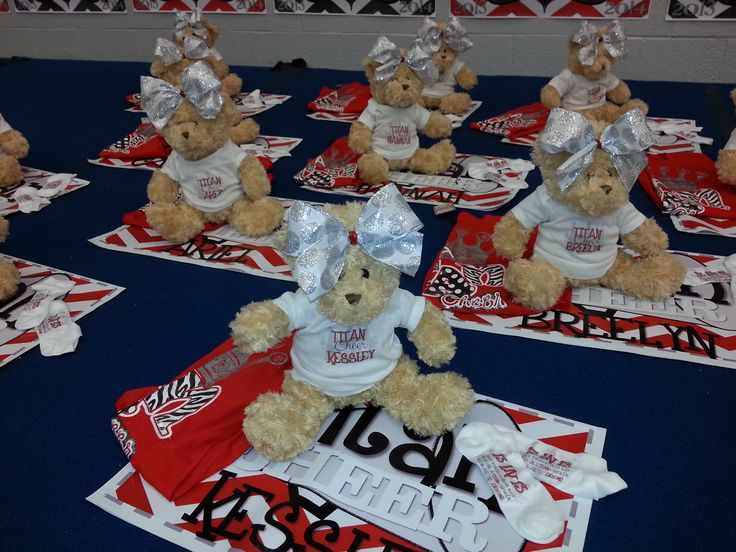 teddy bears dressed in t - shirts and silver foil wrappers