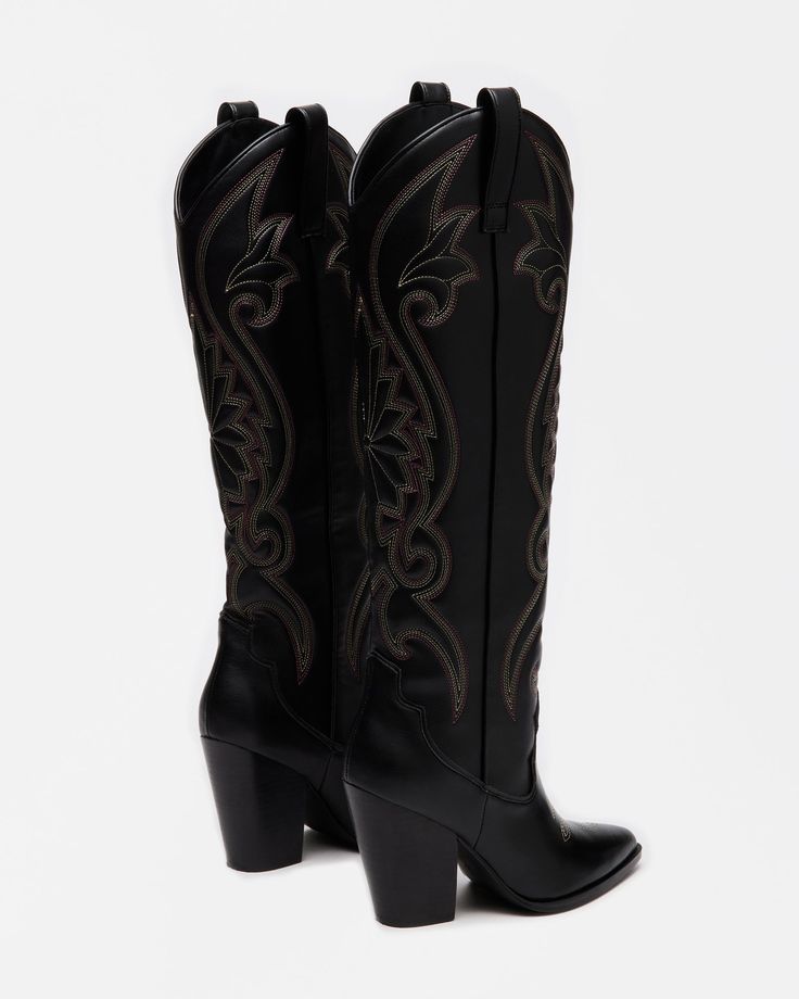 A Western boot is a requirement for any wardrobe and we��’re obsessed with LASSO. This knee-high pair features whipstitching detail and a towering block heel. 3.75 inch heel height Size 6 measurements: 15 inch shaft circumference, 13.25 inch shaft height Size 8 measurements: 15.75 inch shaft circumference, 14.25 inch shaft height Size 10 measurements: 16.75 inch shaft circumference, 15 inch shaft height Vegan leather upper material Textile and synthetic lining Synthetic sock Vegan leather sole Imp Tall Black Cowboy Boots, Black Cowboy Boots, Steve Madden Store, Black Cowboy, Apparel Merchandising, Western Boot, Western Boots, Cowboy Boots, Knee High