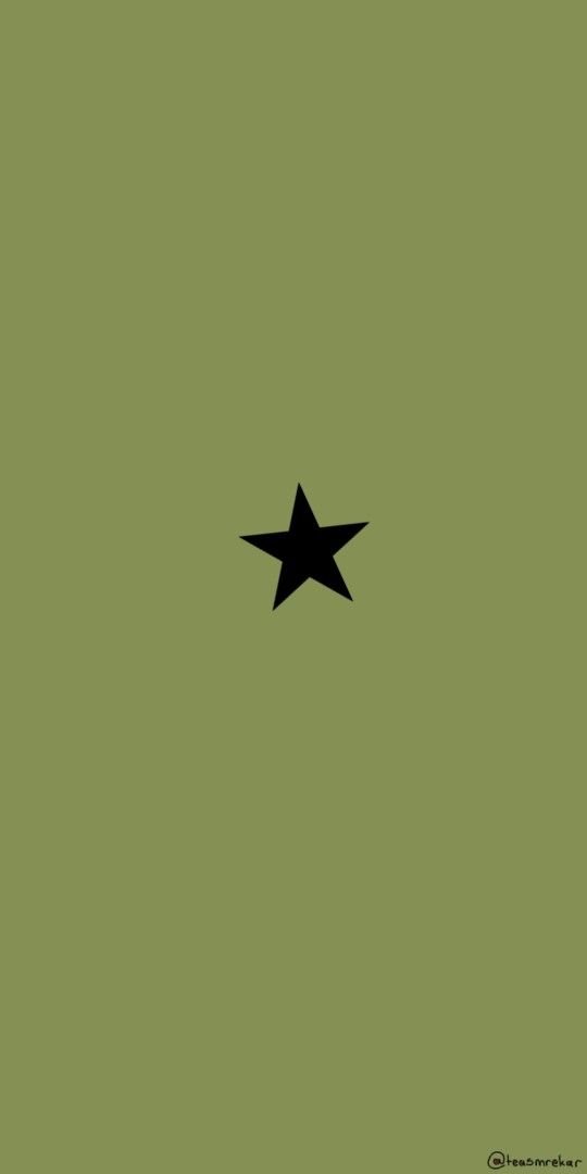 a black star on a green background