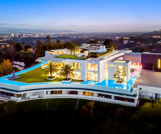 an aerial view of a modern house at night