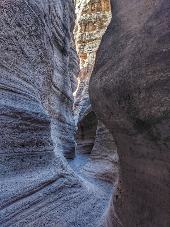 a narrow slot in the side of a mountain