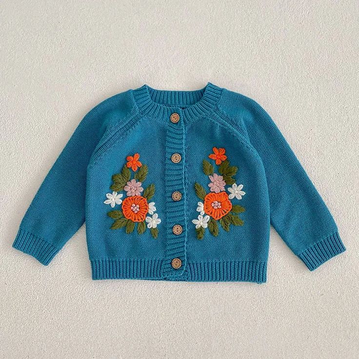 Made from Organic Cotton: An eco-friendly, breathable, and hypoallergenic fabric that’s gentle on delicate skin. Care Instructions: Machine wash on a gentle cycle, tumble dry on low. A Thoughtful Gift: Ideal for birthdays, holidays, or any day you want to make extra special for the little one in your life. Spring Sweater With Multicolor Embroidery And Long Sleeve, Multicolor Embroidered Long Sleeve Spring Sweater, Winter Floral Embroidery Long Sleeve Cardigan, Spring Cotton Sweater With Floral Applique, Spring Blue Embroidered Cardigan, Blue Embroidered Sweater For Spring, Fall Embroidered Long Sleeve Cardigan, Cute Embroidered Cotton Cardigan, Spring Outerwear With Floral Applique And Long Sleeve