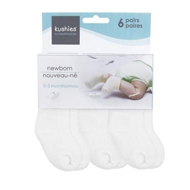 three pairs of white non - slippers for babies with no panties on them, in packaging