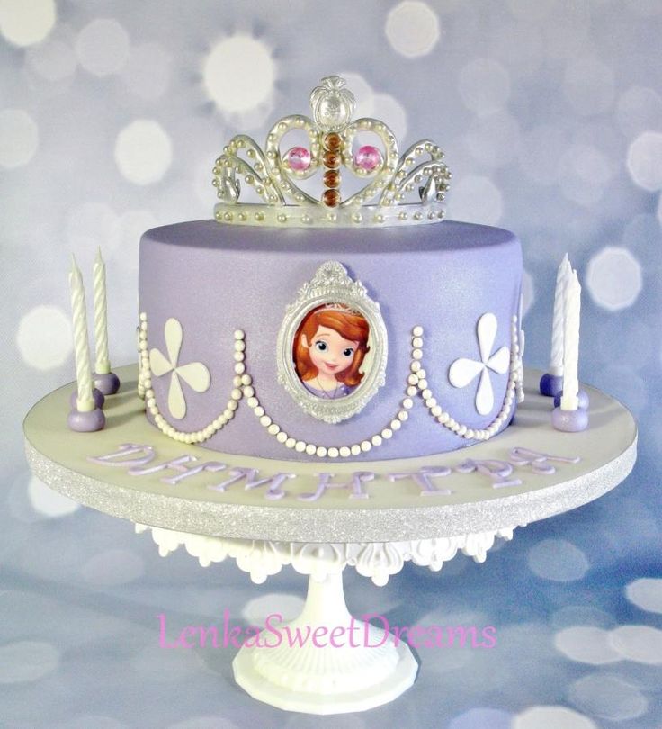 there is a purple cake with a princess on it