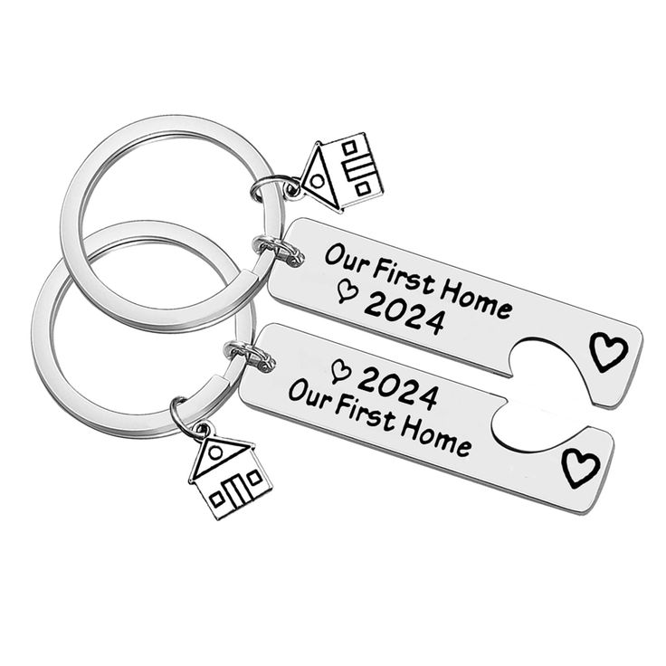 two personalized keychains with hearts and arrows are shown on a white background