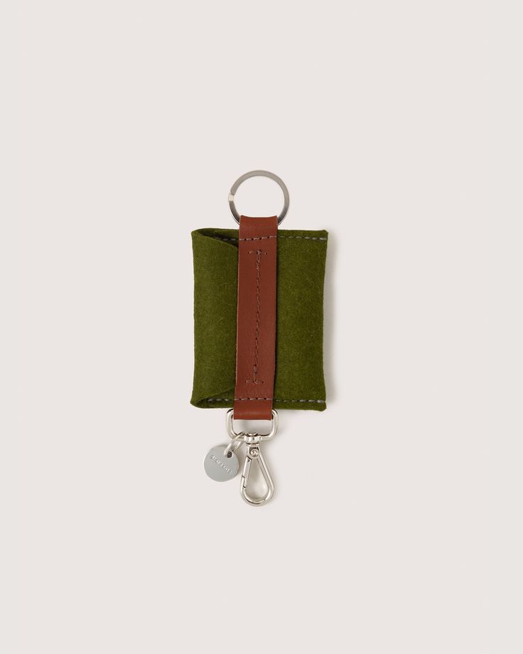 Sleek and practical, the Merino Wool Felt Card Key Fob keeps keys organized and ready to go. Its slim shape and smooth Merino wool feel are ideal for pockets or purses, blending durability with minimalist design.

  

 Benefits of Merino Wool 

  
 * Sustainable, biodegradable, and renewable 
 * Odor, stain, heat, and dirt-resistant 
 * Oeko-Tex® Certified 
 * See all the benefits (https://graf-lantz.com/pages/merino-wool-felt) of our Merino wool 
 * How to clean and care (https://graf-lantz.com Everyday Rectangular Card Holder With Interior Key Chain, Functional Rectangular Card Holder As Gift, Rectangular Card Holder With Key Leash, Rectangular Travel Card Holder With Key Clip, Green Rectangular Card Holder For Personal Use, Everyday Rectangular Card Holder With Key Leash, Wine Carrier Bag, Graf Lantz, Wine Markers