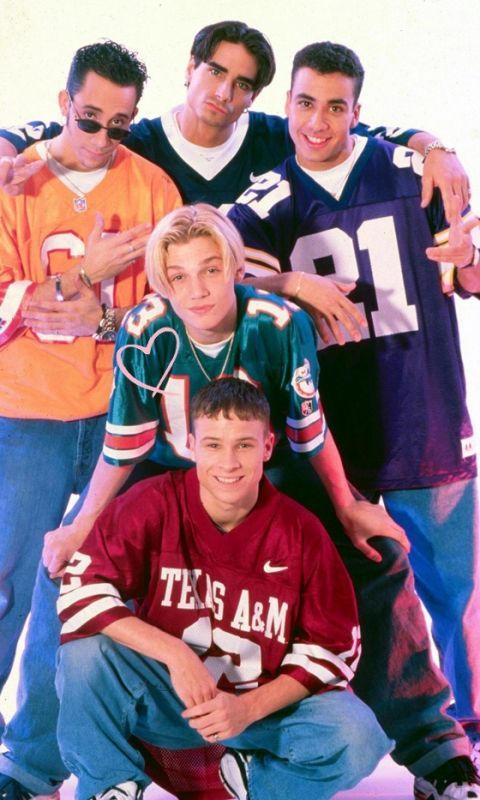 a group of young men standing next to each other