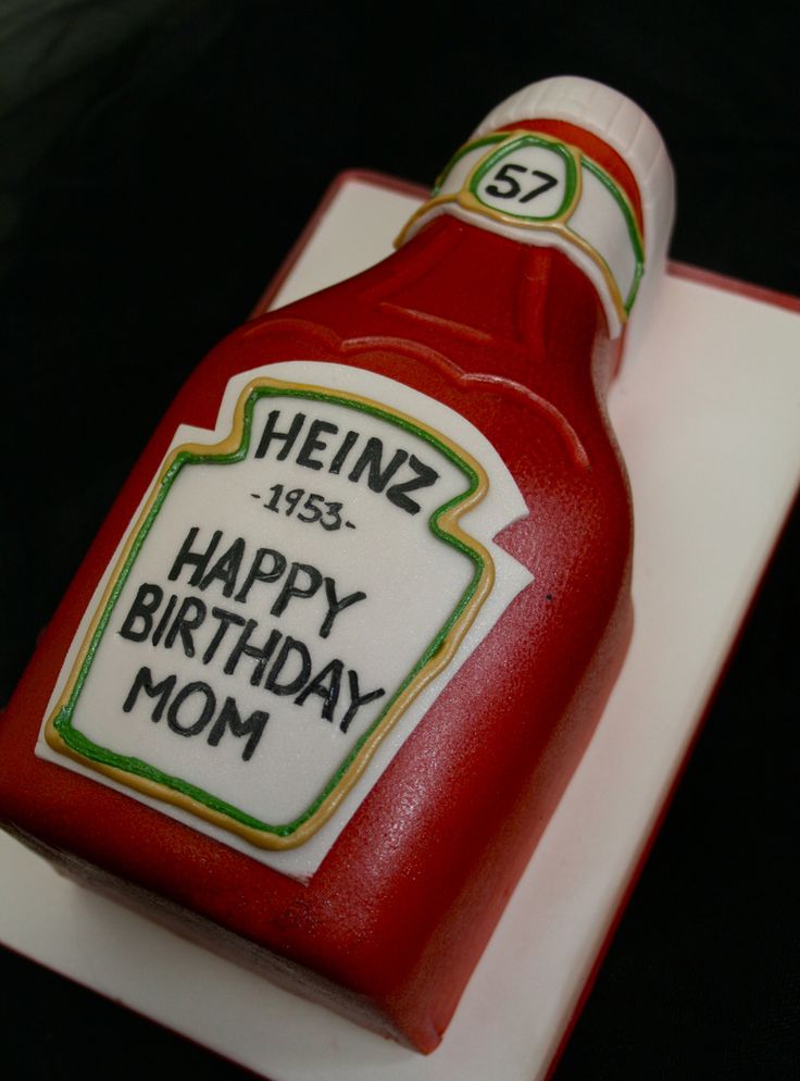 a birthday cake made to look like a ketchup bottle with the words heinzz happy birthday mom on it