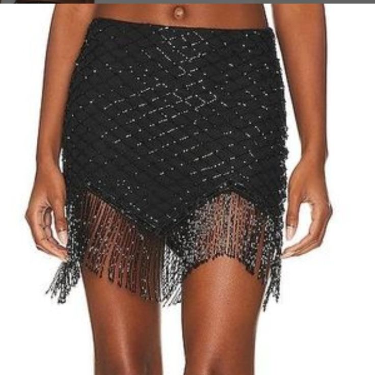 Approximate Measurements 13" Across Waist 16" Across Hips 17-18" Length Chic Party Bottoms With Rhinestone Fringe, Glamorous Black Holiday Skirt, Glamorous Black Skirt For The Holidays, Glamorous Rhinestone Fringe Mini Skirt, Black Embellished Mini Skirt For Party Season, Black Holiday Skirt For Night Out, Party Season Embellished Black Mini Skirt, Glamorous Fringed Bottoms For Night Out, Glamorous Fringe Bottoms For Night Out