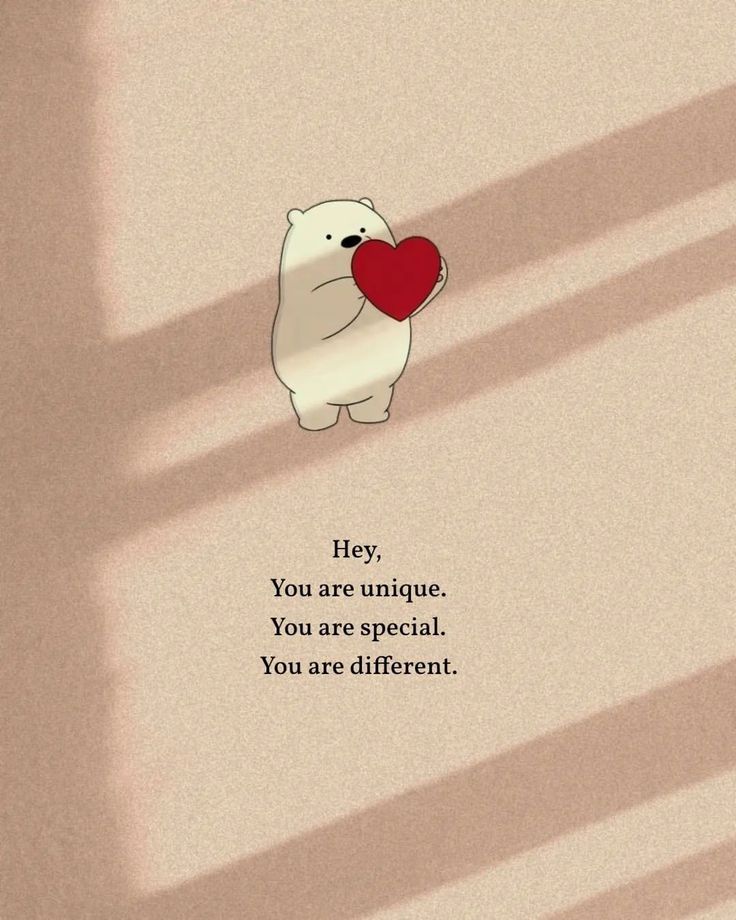 a polar bear holding a red heart in its mouth with the caption hey, you are unique