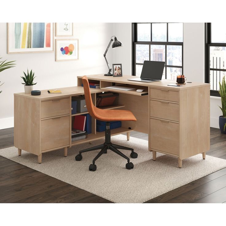 an office desk with a laptop on top of it and a chair in front of it