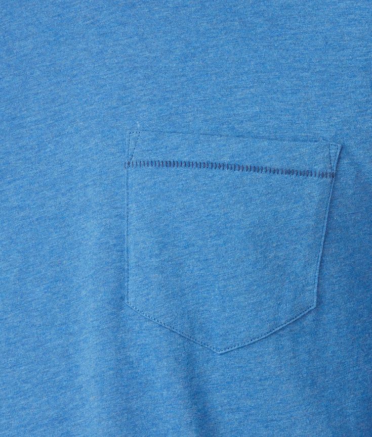 This Long Sleeve Bar Stitch Tee can be dressed up or casually worn. Tucked or untucked, this is a breathable long sleeve silhouette with a tonal chest pocket. Embellished with intricate bar stitching along the chest pocket and shirttail, this detail adds subtle visual texture to a contemporary piece. Side vents allow comfort and breathability. A mirrored-L embellishment on the lower left-hand side of the front gives a subtle Lucchese signature. Model is 6'1 and wearing size M. Casual Blue Tops With Welt Pockets, Washed Blue Long Sleeve Tops With Patch Pockets, Blue Long Sleeve Tops With Welt Pockets, Blue Long Sleeve Top With Patch Pockets, Blue Long Sleeve Top With Side Pockets, Casual Blue Tops With Side Pockets, Sleeve Silhouette, Handcrafted Boots, Handmade Boot