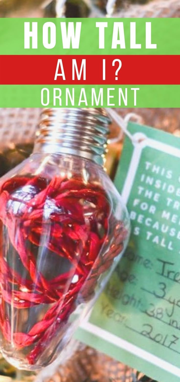 a bottle filled with red string and the words how tall am i? ornament