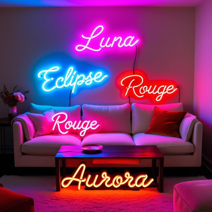 three neon signs on the wall above a couch in a room with pink and blue lighting